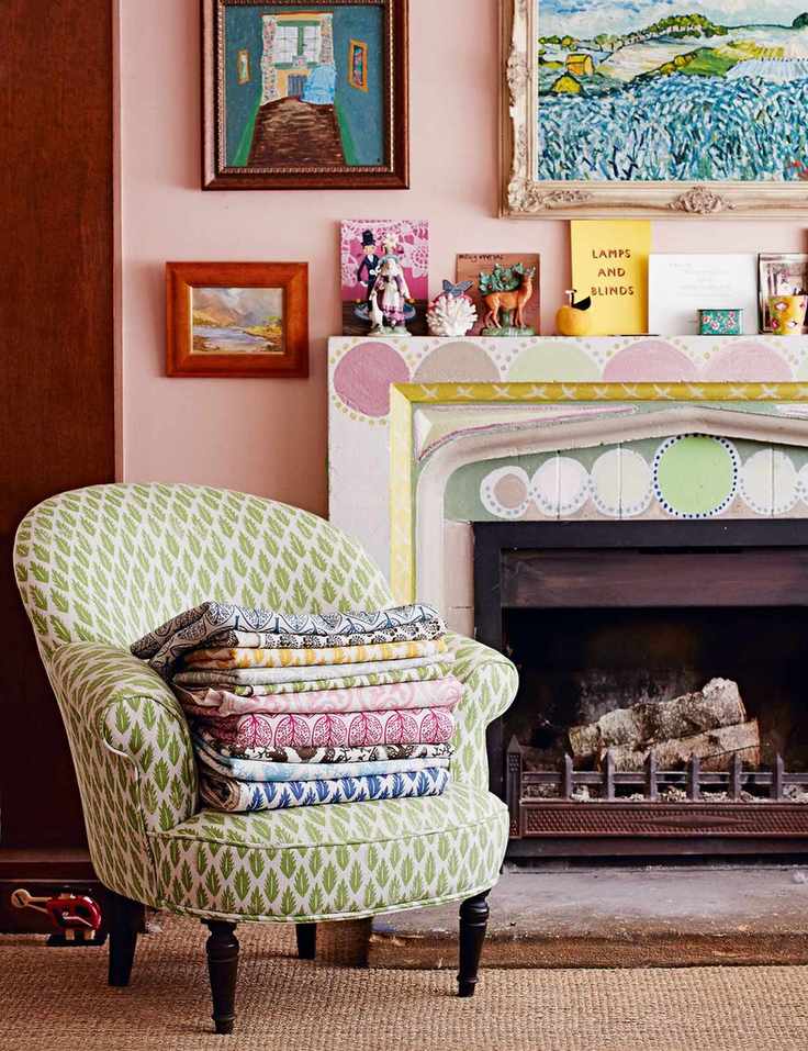 Sewing room with pink walls and framed art