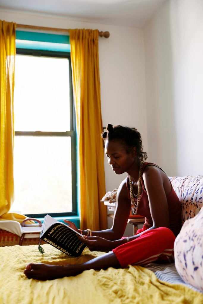 woman reading on bed