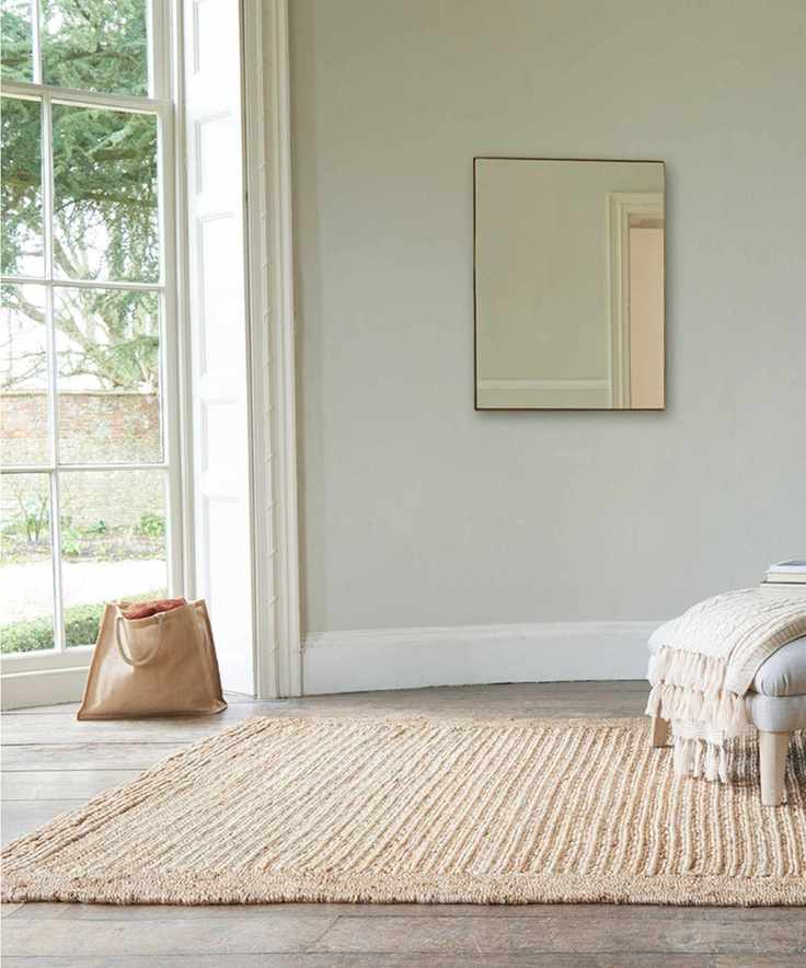 A bobbly jute rug in a bay window