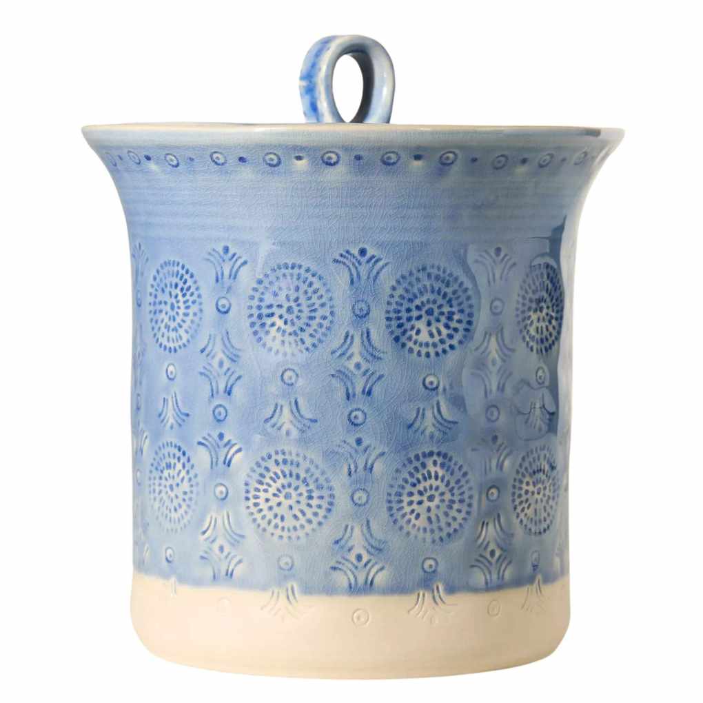 A blue patterned ceramic storage canister