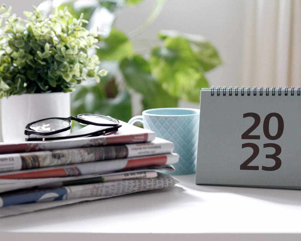 desk with papers and a calendar