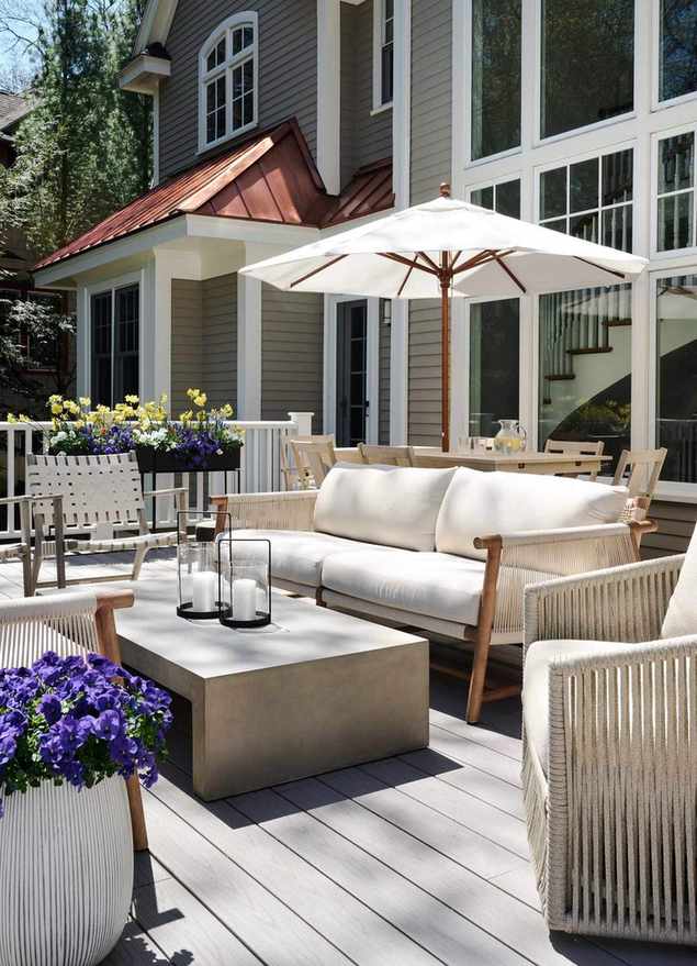 layered outdoor living room neutral furniture