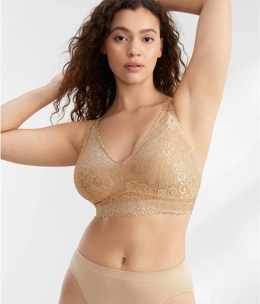 A woman wearing a nude lace bralette