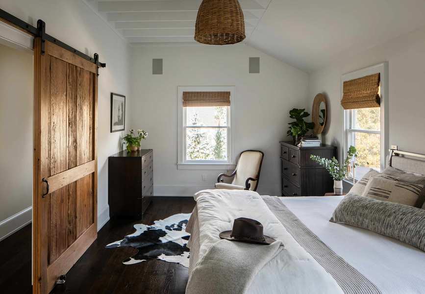cabin bedroom with white walls