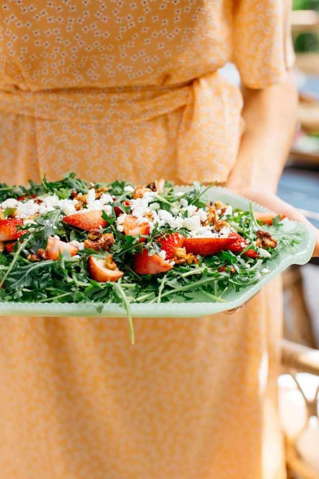 spring strawberry and arugula salad with fresh herbs and goat cheese
