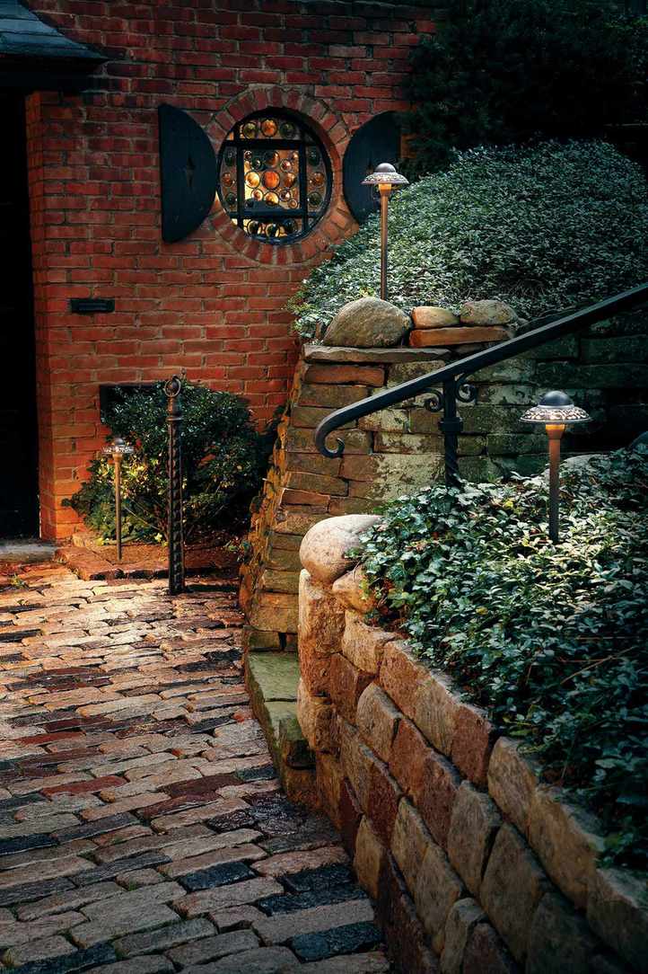 Solar lighting in raised brick wall at front of house