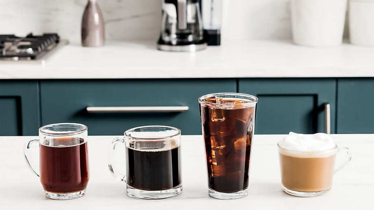 An example of the four types of coffee you can make in the Ninja DualBrew Pro, with the DualBrew Pro in the background