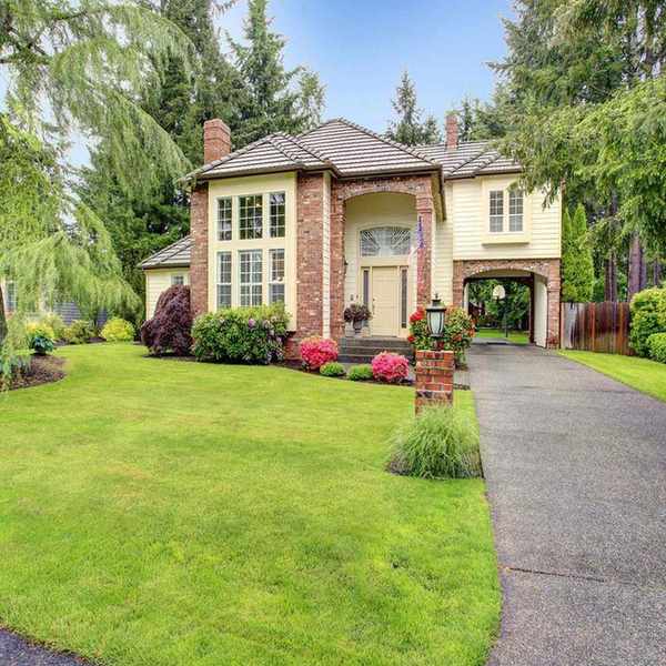 A well maintained front yard and driveway
