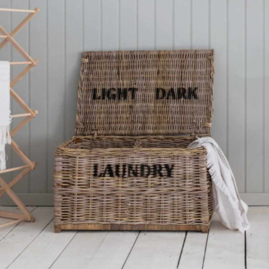 Garden Trading Dark and Lights Laundry Chest on a white wood floor, next to a wooden airer
