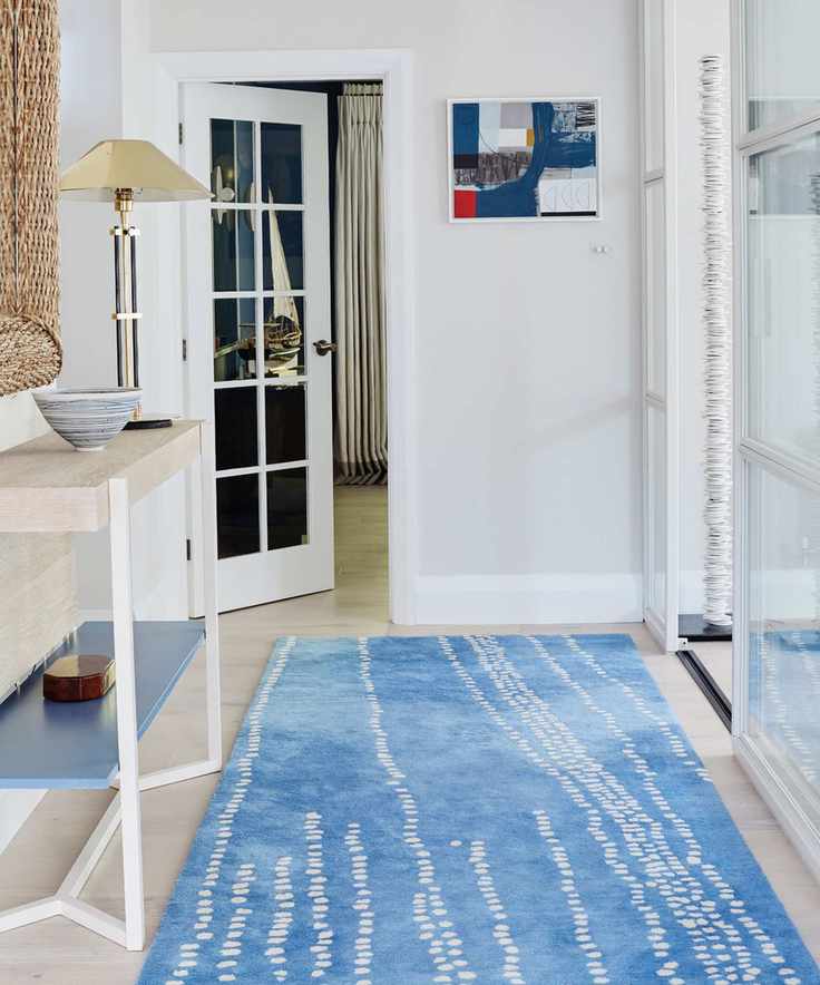 Minimalist hallway with blue accents