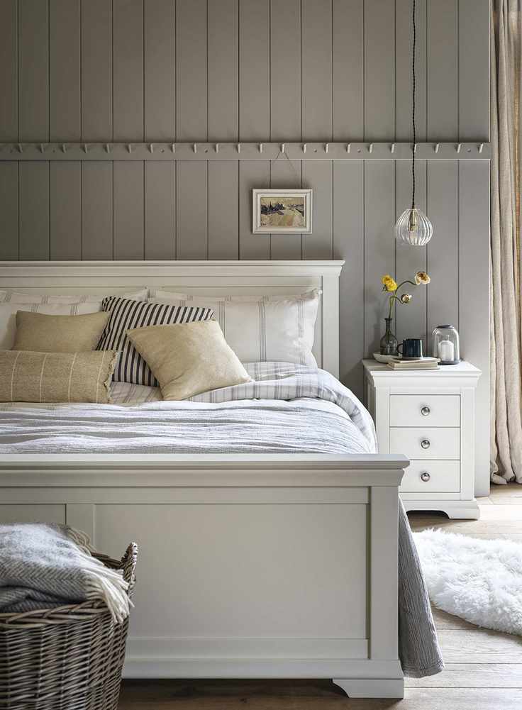 Grey country bedroom with shiplap paneling