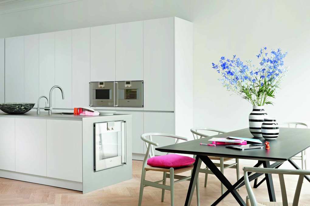 Simple white kitchen wall cabinets and kitchen island