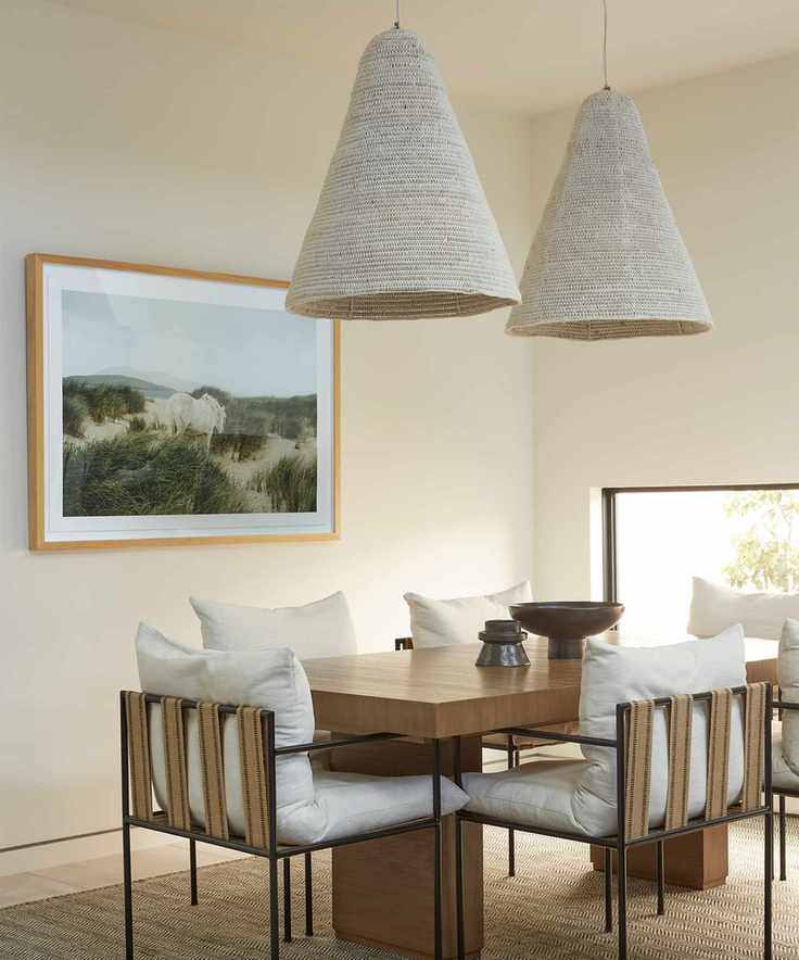 Dining room with cream walls and elegant, textured decor