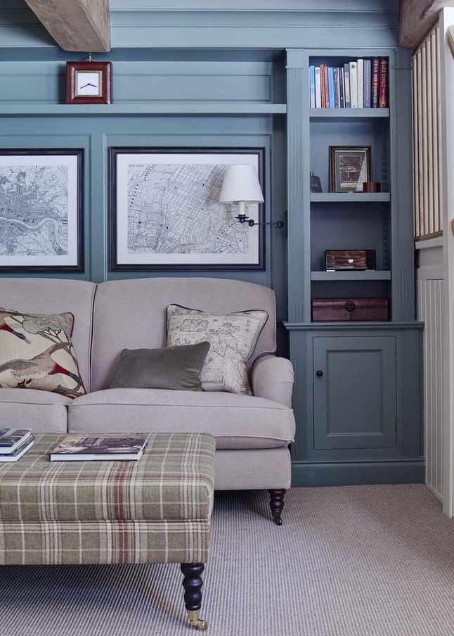 living room with blue panelling and shelves