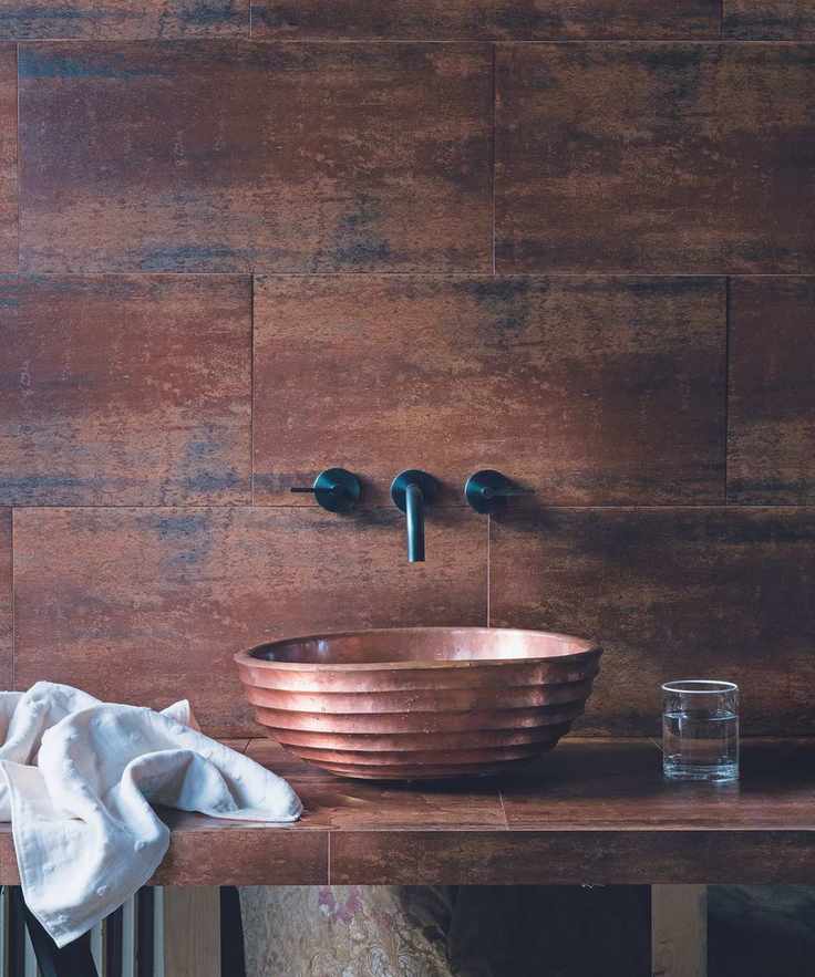 Copper tiles and basin with wall-mounted taps