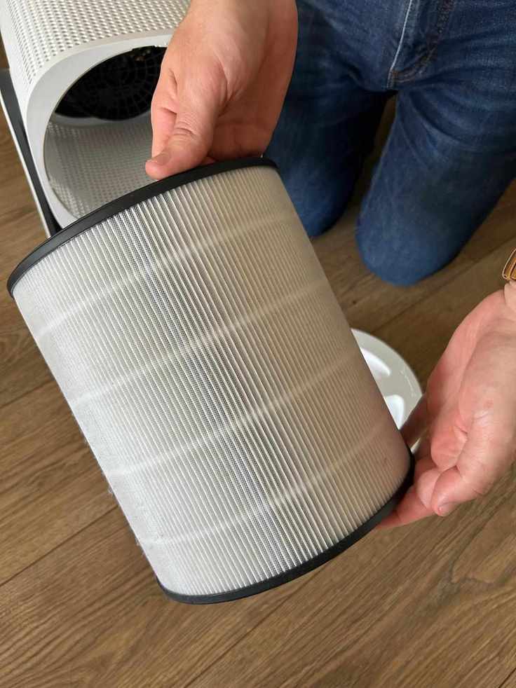The coway airmega aim air purifier being taken apart