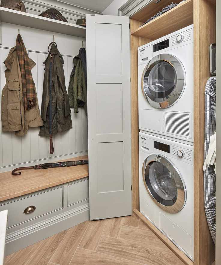 Laundry room featuring stacked washing machine and dryer for space efficiency.