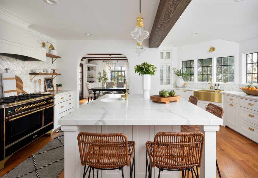 kitchen with white marble island top and black range cooker